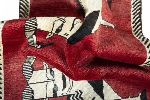 Corner detail of 2000s Persian Gabbeh rug showing border pattern and Wool pile