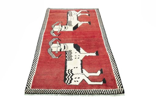 Surface texture of 2000s Persian Gabbeh rug with natural Wool and intricate pattern