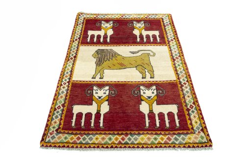 Surface texture of 2000s Persian Gabbeh rug with natural Wool and intricate pattern