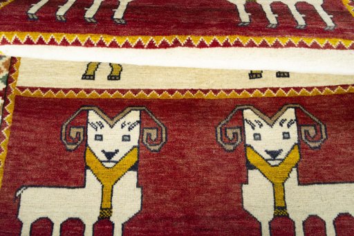 Full view of 2000s Persian Gabbeh rug from Iran / Persia, 157 × 108 cm in Red tones