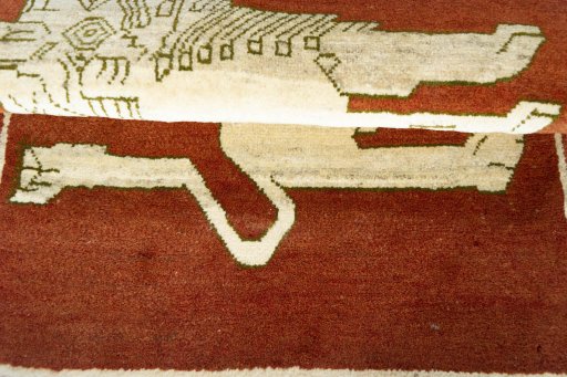 Full view of 2000s Persian Gabbeh rug from Iran / Persia, 126 × 86 cm in Red tones