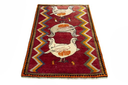Surface texture of 2000s Persian Gabbeh rug with natural Wool and intricate pattern