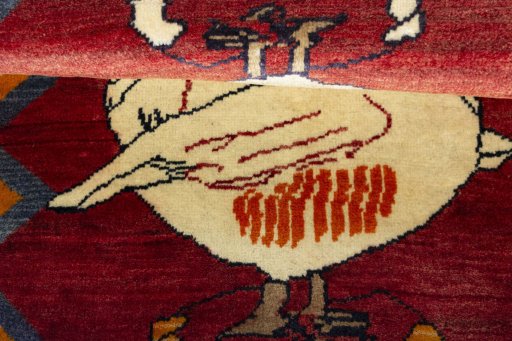 Full view of 2000s Persian Gabbeh rug from Iran / Persia, 142 × 100 cm in Red tones