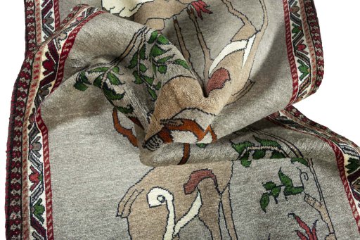Corner detail of 2000s Persian Gabbeh rug showing border pattern and Wool pile