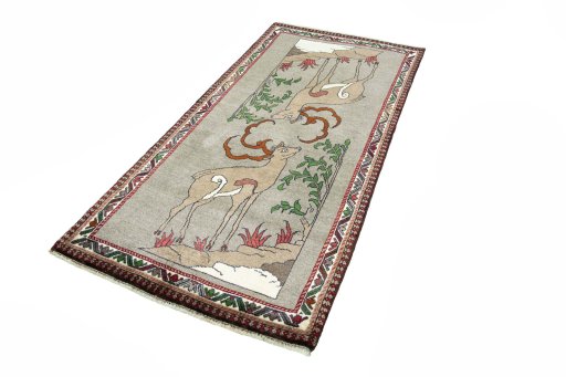 Corner detail of 2000s Persian Gabbeh rug showing border pattern and Wool pile