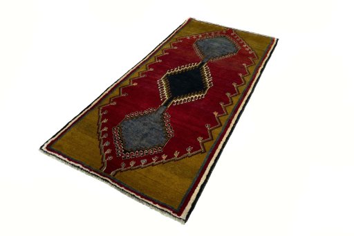 Corner detail of 2000s Persian Gabbeh rug showing border pattern and Wool pile