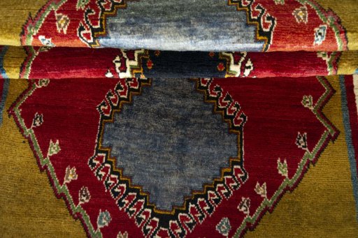 Full view of 2000s Persian Gabbeh rug from Iran / Persia, 205 × 97 cm in Red tones