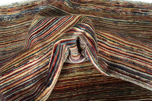 Corner detail of 2000s Persian Gabbeh rug showing border pattern and Wool pile