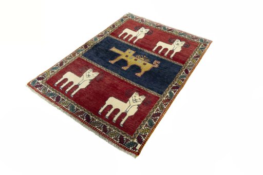 Corner detail of 2000s Persian Gabbeh rug showing border pattern and Wool pile