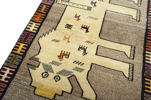 Backside of handmade 2000s Persian Gabbeh rug showing knot structure and weave density