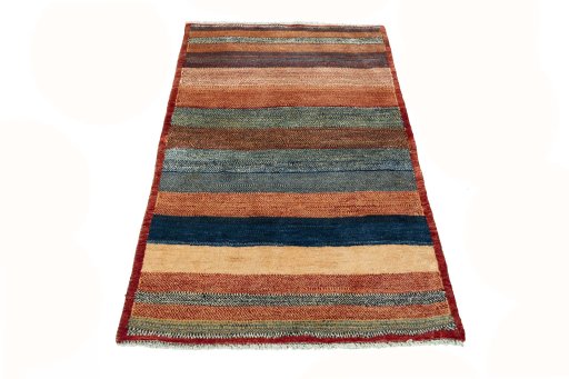 Surface texture of 2000s Persian Gabbeh rug with natural Wool and intricate pattern