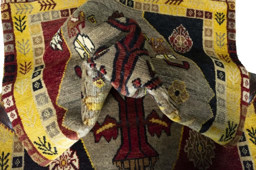 Corner detail of 2000s Persian Gabbeh rug showing border pattern and Wool pile