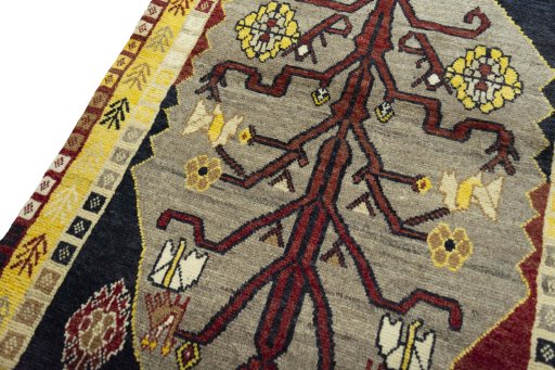 Backside of handmade 2000s Persian Gabbeh rug showing knot structure and weave density