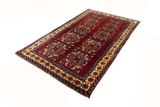 Corner detail of 2000s Persian Gabbeh rug showing border pattern and Wool pile