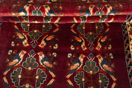 Full view of 2000s Persian Gabbeh rug from Iran / Persia, 233 × 141 cm in Red tones