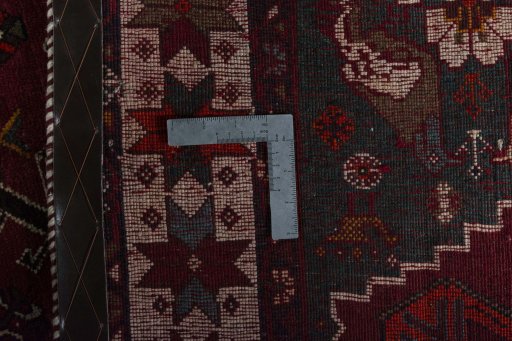 Surface texture of 2000s Persian Gabbeh rug with natural Wool and intricate pattern