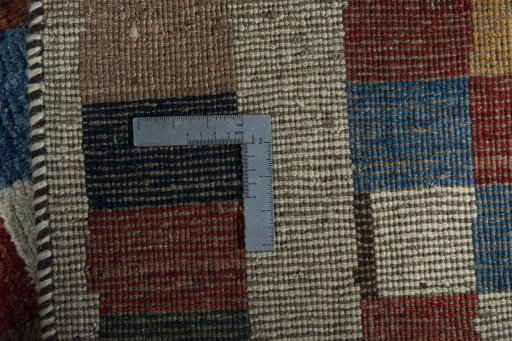 Close-up detail of 2000s Persian Gabbeh rug from Iran / Persia showing Wool weave