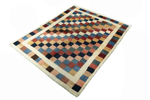 Corner detail of 2000s Persian Gabbeh rug showing border pattern and Wool pile