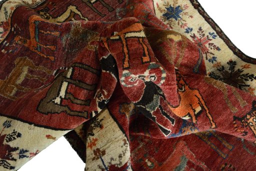 Corner detail of 2000s Persian Gabbeh rug showing border pattern and Wool pile