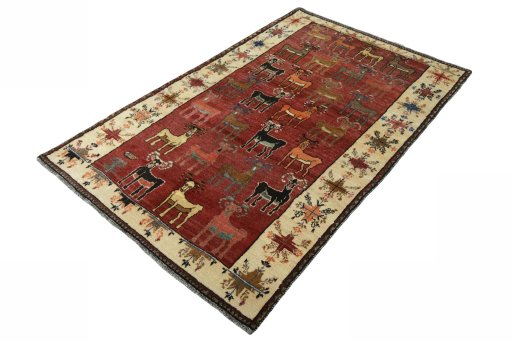Corner detail of 2000s Persian Gabbeh rug showing border pattern and Wool pile