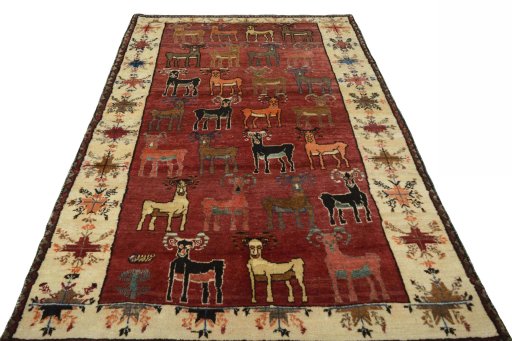 Surface texture of 2000s Persian Gabbeh rug with natural Wool and intricate pattern