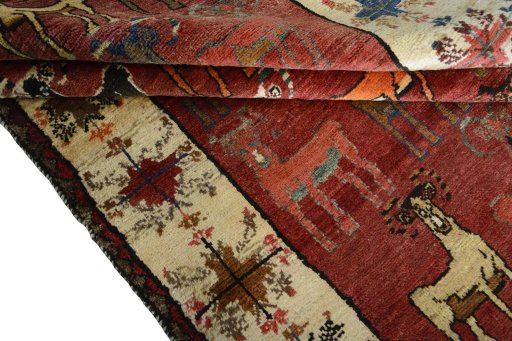 Full view of 2000s Persian Gabbeh rug from Iran / Persia, 243 × 150 cm in Red tones