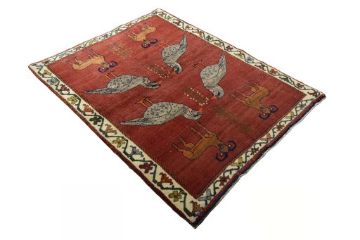 Corner detail of 2000s Persian Gabbeh rug showing border pattern and Wool pile