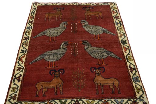 Surface texture of 2000s Persian Gabbeh rug with natural Wool and intricate pattern