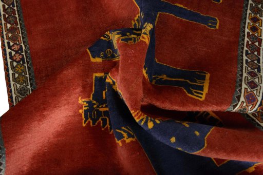 Corner detail of 2000s Persian Gabbeh rug showing border pattern and Wool pile