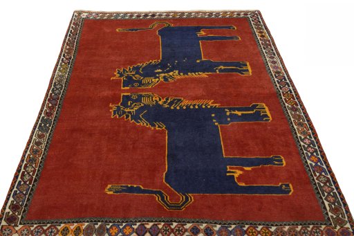 Surface texture of 2000s Persian Gabbeh rug with natural Wool and intricate pattern