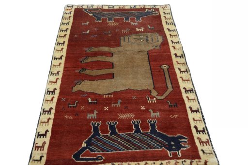 Surface texture of 2000s Persian Gabbeh rug with natural Wool and intricate pattern