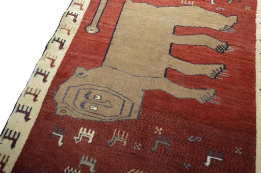 Backside of handmade 2000s Persian Gabbeh rug showing knot structure and weave density