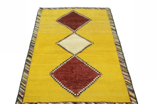 Surface texture of 2000s Persian Gabbeh rug with natural Wool and intricate pattern