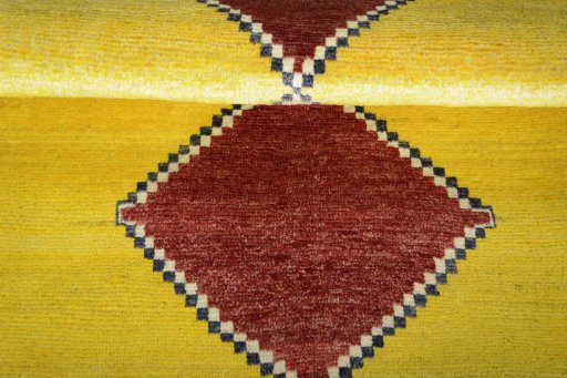Full view of 2000s Persian Gabbeh rug from Iran / Persia, 147 × 101 cm in Yellow tones