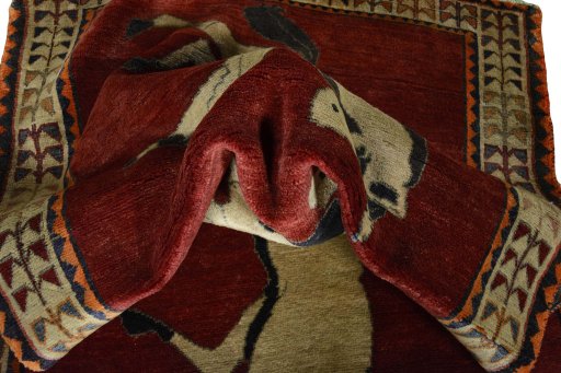 Corner detail of 2000s Persian Gabbeh rug showing border pattern and Wool pile