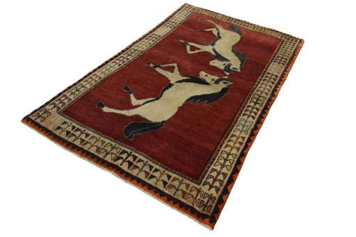 Corner detail of 2000s Persian Gabbeh rug showing border pattern and Wool pile
