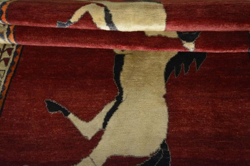 Full view of 2000s Persian Gabbeh rug from Iran / Persia, 210 × 133 cm in Red tones