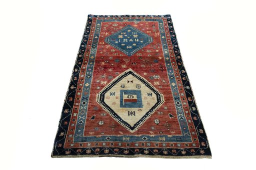 Surface texture of 2000s Persian Gabbeh rug with natural Wool and intricate pattern