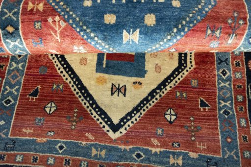 Full view of 2000s Persian Gabbeh rug from Iran / Persia, 190 × 107 cm in Red tones