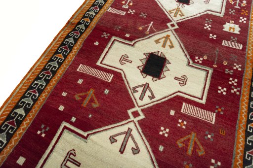 Backside of handmade 2000s Persian Gabbeh rug showing knot structure and weave density