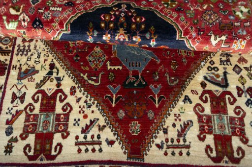 Corner detail of 2000s Persian Gabbeh rug showing border pattern and Wool pile