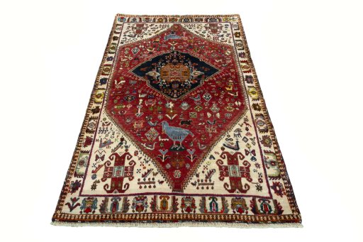 Surface texture of 2000s Persian Gabbeh rug with natural Wool and intricate pattern