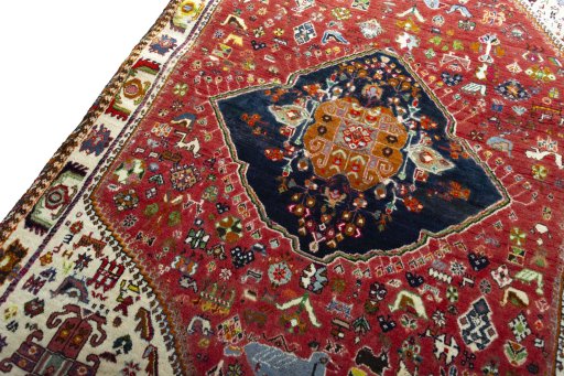 Backside of handmade 2000s Persian Gabbeh rug showing knot structure and weave density