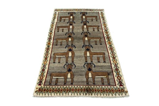 Surface texture of 2000s Persian Gabbeh rug with natural Wool and intricate pattern