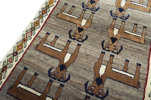 Backside of handmade 2000s Persian Gabbeh rug showing knot structure and weave density