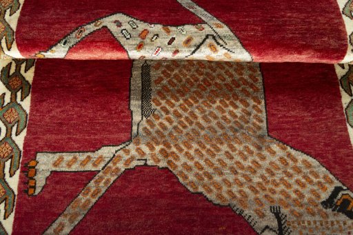 Full view of 2000s Persian Gabbeh rug from Iran / Persia, 155 × 100 cm in Red tones
