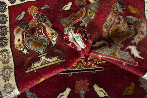 Corner detail of 2000s Persian Gabbeh rug showing border pattern and Wool pile