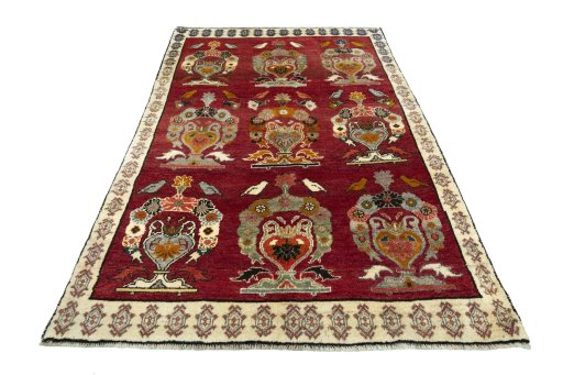 Surface texture of 2000s Persian Gabbeh rug with natural Wool and intricate pattern
