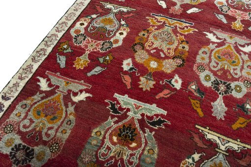 Backside of handmade 2000s Persian Gabbeh rug showing knot structure and weave density