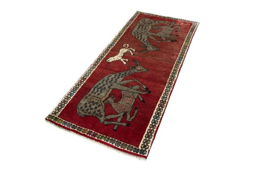 Corner detail of 2000s Persian Gabbeh rug showing border pattern and Wool pile
